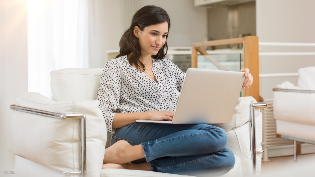 Woman researching a plastic surgeon in Staten Island, NY